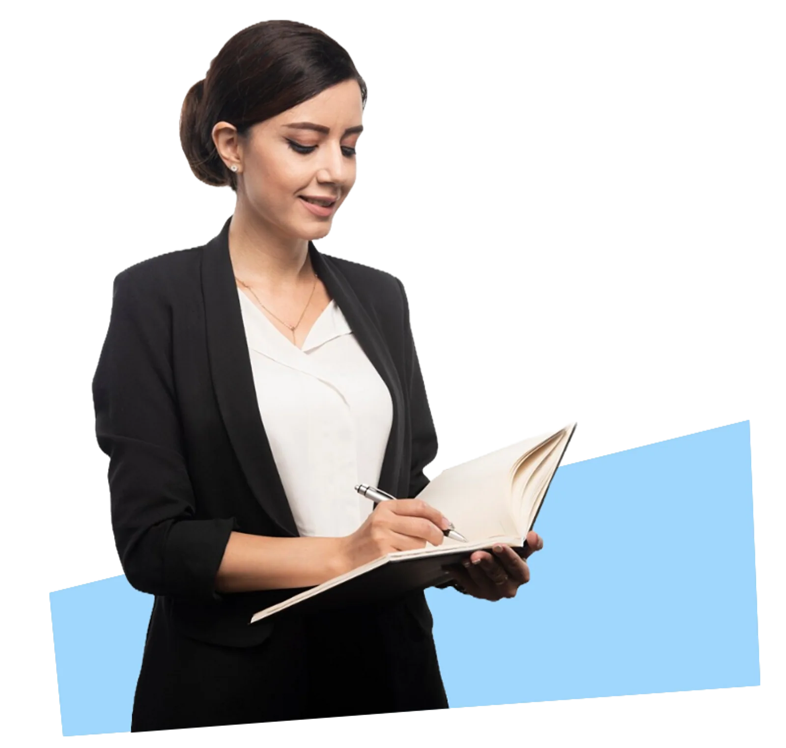 A businesswoman smiles while writing in a notebook, demonstrating foundation skills training with CAQA LLND.