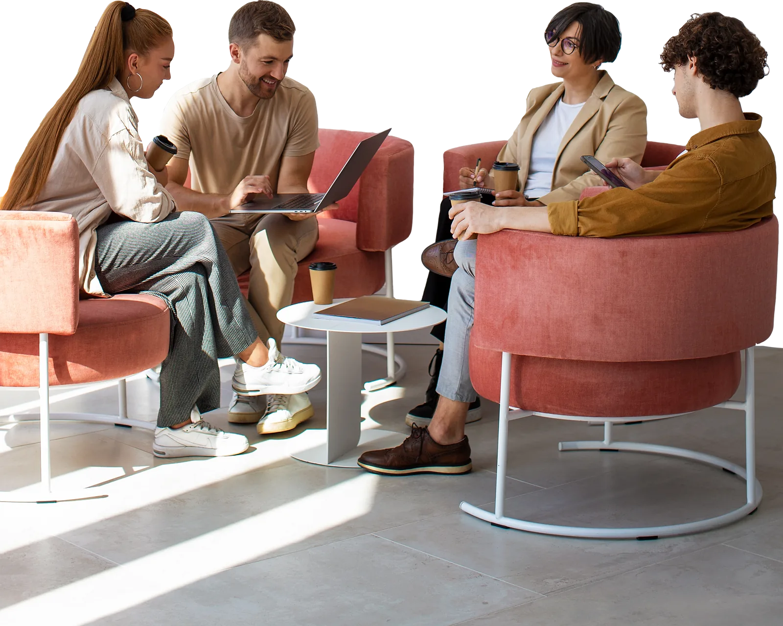 A business team collaborates around a table, demonstrating employability skills in a casual office setting.