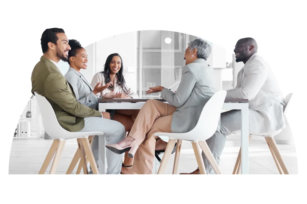 A diverse group of professionals collaborates around a conference table, demonstrating CAQA LLND’s commitment to.