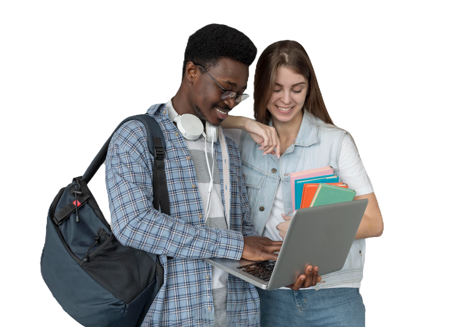 Two students collaborate on a laptop while holding books and wearing backpacks, demonstrating foundation skills training.