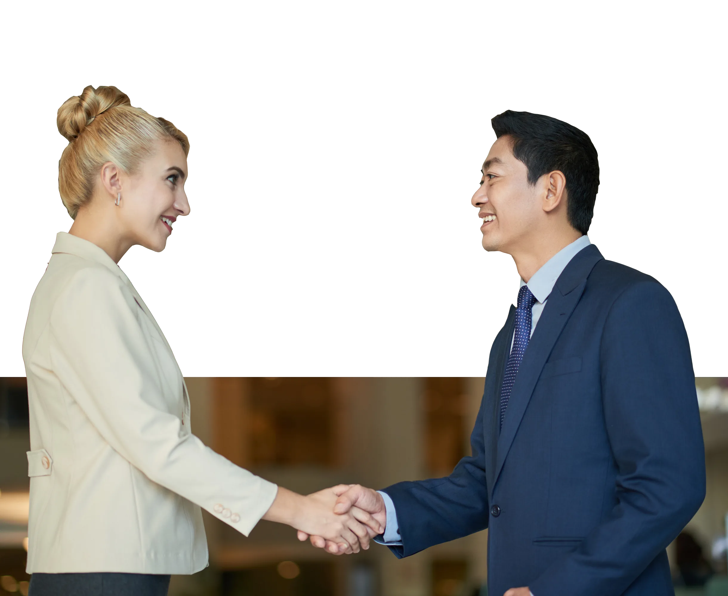 Two professionals shake hands during a workplace LLND training session, demonstrating effective communication skills.
