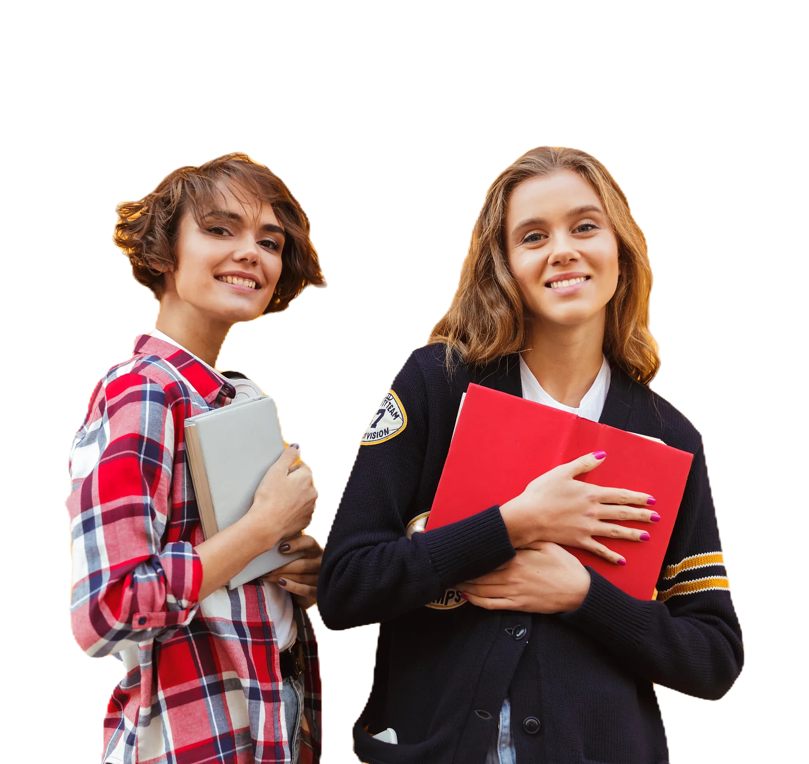 Two smiling teenage students hold books while learning foundational skills.